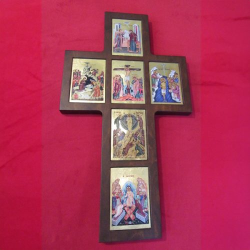 Wooden cross depicting the life of Christ