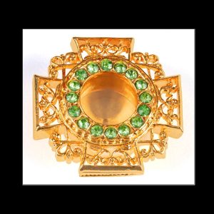 Brass reliquary with gold gilding and green stones