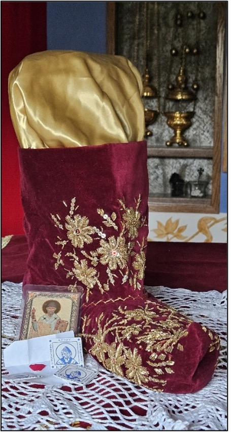 A slipper of Saint Spyridon at the Queen of All Skete, along with filaktas from Corfu containing snippets of his slippers.